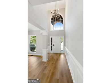 Welcome home to this stunning 3-story brick residence in the on Canongate At Heron Bay in Georgia - for sale on GolfHomes.com, golf home, golf lot