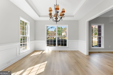 Welcome home to this stunning 3-story brick residence in the on Canongate At Heron Bay in Georgia - for sale on GolfHomes.com, golf home, golf lot