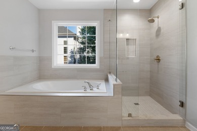 Welcome home to this stunning 3-story brick residence in the on Canongate At Heron Bay in Georgia - for sale on GolfHomes.com, golf home, golf lot