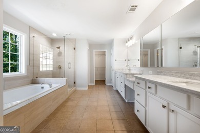 Welcome home to this stunning 3-story brick residence in the on Canongate At Heron Bay in Georgia - for sale on GolfHomes.com, golf home, golf lot