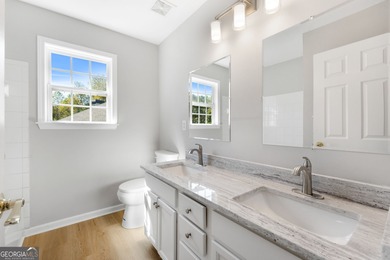 Welcome home to this stunning 3-story brick residence in the on Canongate At Heron Bay in Georgia - for sale on GolfHomes.com, golf home, golf lot