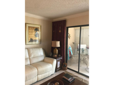 Enjoy breathtaking water views from this top-floor condo in the on Marina Lakes Golf Course in Florida - for sale on GolfHomes.com, golf home, golf lot