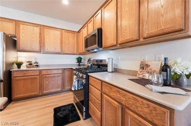 This beautifully maintained home has beautiful views of the golf on Aliante Golf Club in Nevada - for sale on GolfHomes.com, golf home, golf lot