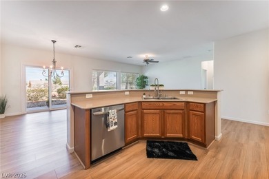 This beautifully maintained home has beautiful views of the golf on Aliante Golf Club in Nevada - for sale on GolfHomes.com, golf home, golf lot