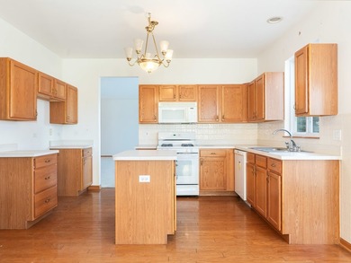 Sprawling ranch townhome with stunning pond views in the sought on The Links at Carillon in Illinois - for sale on GolfHomes.com, golf home, golf lot