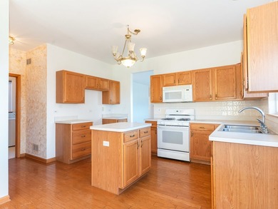 Sprawling ranch townhome with stunning pond views in the sought on The Links at Carillon in Illinois - for sale on GolfHomes.com, golf home, golf lot