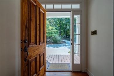 Discover timeless Southern elegance and luxury lakefront living on Great Waters Course At Reynolds Plantation in Georgia - for sale on GolfHomes.com, golf home, golf lot