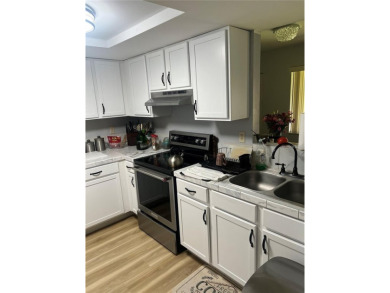 This stunning 55+ recently renovated 2 bedroom 1.5 bath condo on Country Club At Silver Springs Shores in Florida - for sale on GolfHomes.com, golf home, golf lot