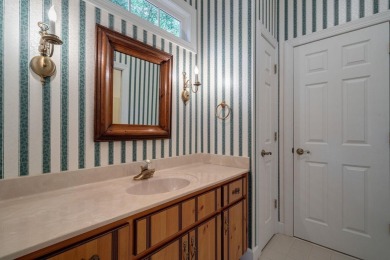 Discover timeless Southern elegance and luxury lakefront living on Great Waters Course At Reynolds Plantation in Georgia - for sale on GolfHomes.com, golf home, golf lot