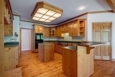 Discover timeless Southern elegance and luxury lakefront living on Great Waters Course At Reynolds Plantation in Georgia - for sale on GolfHomes.com, golf home, golf lot