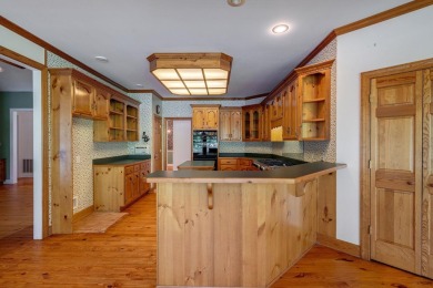 Discover timeless Southern elegance and luxury lakefront living on Great Waters Course At Reynolds Plantation in Georgia - for sale on GolfHomes.com, golf home, golf lot