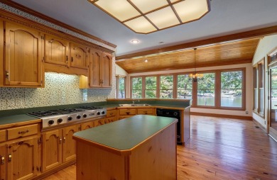 Discover timeless Southern elegance and luxury lakefront living on Great Waters Course At Reynolds Plantation in Georgia - for sale on GolfHomes.com, golf home, golf lot