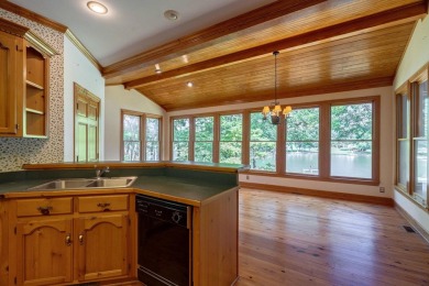 Discover timeless Southern elegance and luxury lakefront living on Great Waters Course At Reynolds Plantation in Georgia - for sale on GolfHomes.com, golf home, golf lot