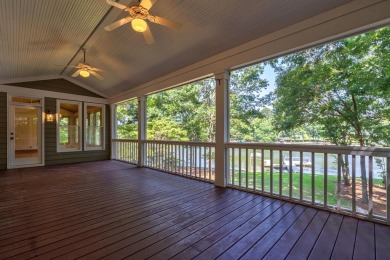 Discover timeless Southern elegance and luxury lakefront living on Great Waters Course At Reynolds Plantation in Georgia - for sale on GolfHomes.com, golf home, golf lot