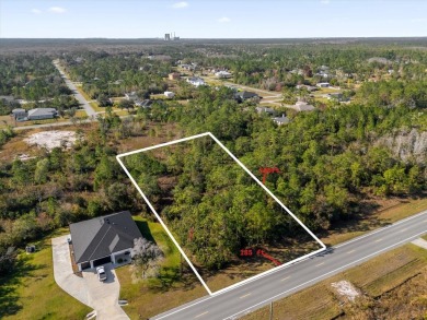 Discover the allure of this exceptional 1.24-acre wooded lot on Wedgefield Golf Club in Florida - for sale on GolfHomes.com, golf home, golf lot