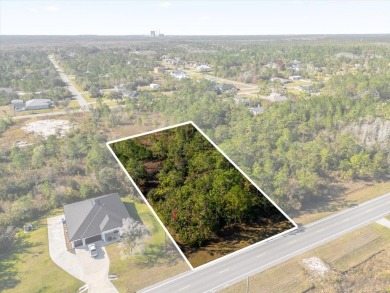 Discover the allure of this exceptional 1.24-acre wooded lot on Wedgefield Golf Club in Florida - for sale on GolfHomes.com, golf home, golf lot