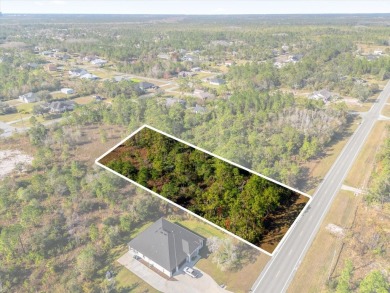 Discover the allure of this exceptional 1.24-acre wooded lot on Wedgefield Golf Club in Florida - for sale on GolfHomes.com, golf home, golf lot