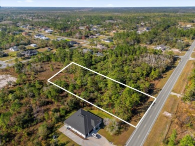 Discover the allure of this exceptional 1.24-acre wooded lot on Wedgefield Golf Club in Florida - for sale on GolfHomes.com, golf home, golf lot