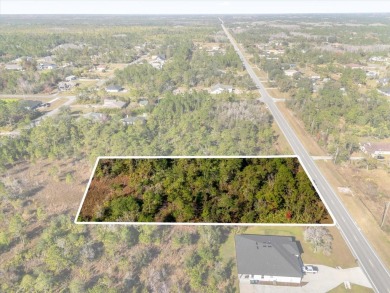 Discover the allure of this exceptional 1.24-acre wooded lot on Wedgefield Golf Club in Florida - for sale on GolfHomes.com, golf home, golf lot