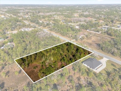 Discover the allure of this exceptional 1.24-acre wooded lot on Wedgefield Golf Club in Florida - for sale on GolfHomes.com, golf home, golf lot