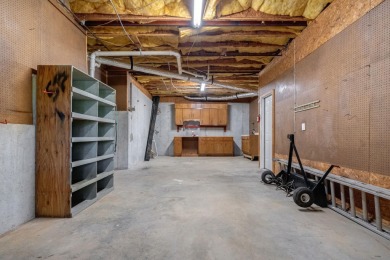 Discover timeless Southern elegance and luxury lakefront living on Great Waters Course At Reynolds Plantation in Georgia - for sale on GolfHomes.com, golf home, golf lot