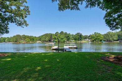 Discover timeless Southern elegance and luxury lakefront living on Great Waters Course At Reynolds Plantation in Georgia - for sale on GolfHomes.com, golf home, golf lot