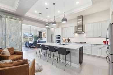 This stunning home is the beautiful sought -out Avalon floor on Wildhorse Golf Club of Robson Ranch in Texas - for sale on GolfHomes.com, golf home, golf lot