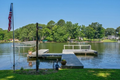 Discover timeless Southern elegance and luxury lakefront living on Great Waters Course At Reynolds Plantation in Georgia - for sale on GolfHomes.com, golf home, golf lot