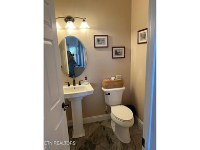 After driving past the picturesque stables and horses and on Rarity Bay Country Club - Loudon in Tennessee - for sale on GolfHomes.com, golf home, golf lot