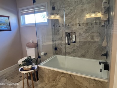 After driving past the picturesque stables and horses and on Rarity Bay Country Club - Loudon in Tennessee - for sale on GolfHomes.com, golf home, golf lot