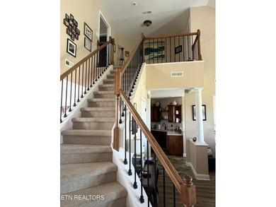 After driving past the picturesque stables and horses and on Rarity Bay Country Club - Loudon in Tennessee - for sale on GolfHomes.com, golf home, golf lot