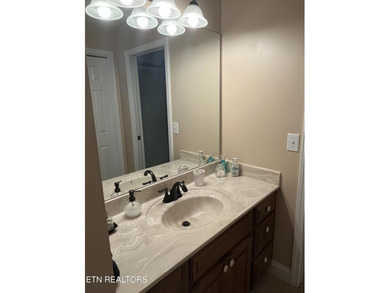 After driving past the picturesque stables and horses and on Rarity Bay Country Club - Loudon in Tennessee - for sale on GolfHomes.com, golf home, golf lot