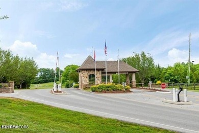 After driving past the picturesque stables and horses and on Rarity Bay Country Club - Loudon in Tennessee - for sale on GolfHomes.com, golf home, golf lot