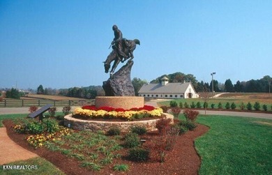 After driving past the picturesque stables and horses and on Rarity Bay Country Club - Loudon in Tennessee - for sale on GolfHomes.com, golf home, golf lot