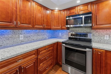 This tastefully remodeled 1/1 condo in Century Village on Flamingo Lakes Country Club in Florida - for sale on GolfHomes.com, golf home, golf lot