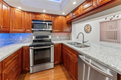 This tastefully remodeled 1/1 condo in Century Village on Flamingo Lakes Country Club in Florida - for sale on GolfHomes.com, golf home, golf lot