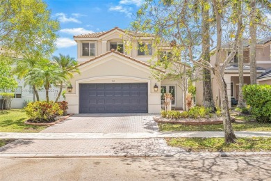 Exquisite 4BR/4BA pool home nestled on a private cul-de-sac in on Weston Hills Country Club in Florida - for sale on GolfHomes.com, golf home, golf lot
