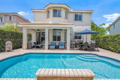 Exquisite 4BR/4BA pool home nestled on a private cul-de-sac in on Weston Hills Country Club in Florida - for sale on GolfHomes.com, golf home, golf lot