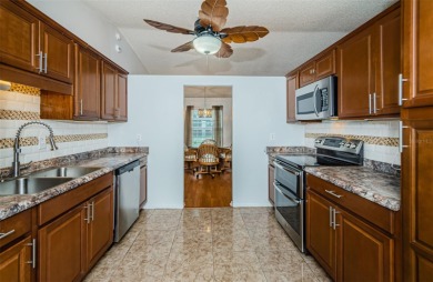 AFFORDABLE HOME IN THE HEART OF SPRING HILL ~ Welcome to this on Oak Hills Country Club in Florida - for sale on GolfHomes.com, golf home, golf lot