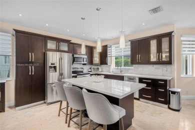 Exquisite 4BR/4BA pool home nestled on a private cul-de-sac in on Weston Hills Country Club in Florida - for sale on GolfHomes.com, golf home, golf lot