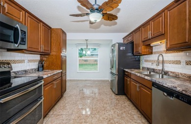 AFFORDABLE HOME IN THE HEART OF SPRING HILL ~ Welcome to this on Oak Hills Country Club in Florida - for sale on GolfHomes.com, golf home, golf lot