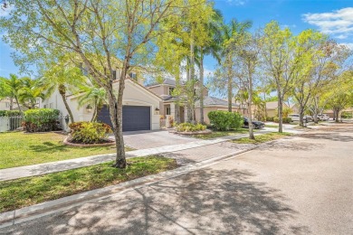 Exquisite 4BR/4BA pool home nestled on a private cul-de-sac in on Weston Hills Country Club in Florida - for sale on GolfHomes.com, golf home, golf lot