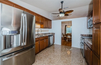 AFFORDABLE HOME IN THE HEART OF SPRING HILL ~ Welcome to this on Oak Hills Country Club in Florida - for sale on GolfHomes.com, golf home, golf lot