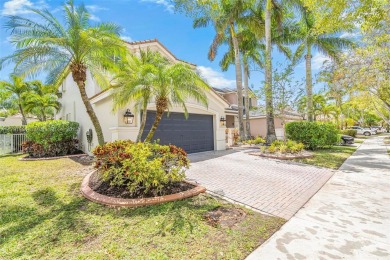 Exquisite 4BR/4BA pool home nestled on a private cul-de-sac in on Weston Hills Country Club in Florida - for sale on GolfHomes.com, golf home, golf lot