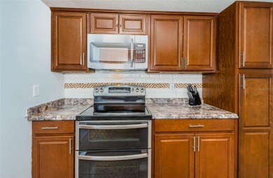 AFFORDABLE HOME IN THE HEART OF SPRING HILL ~ Welcome to this on Oak Hills Country Club in Florida - for sale on GolfHomes.com, golf home, golf lot
