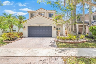 Exquisite 4BR/4BA pool home nestled on a private cul-de-sac in on Weston Hills Country Club in Florida - for sale on GolfHomes.com, golf home, golf lot