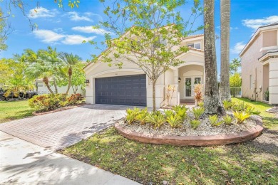 Exquisite 4BR/4BA pool home nestled on a private cul-de-sac in on Weston Hills Country Club in Florida - for sale on GolfHomes.com, golf home, golf lot