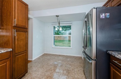 AFFORDABLE HOME IN THE HEART OF SPRING HILL ~ Welcome to this on Oak Hills Country Club in Florida - for sale on GolfHomes.com, golf home, golf lot