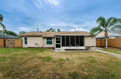 AFFORDABLE HOME IN THE HEART OF SPRING HILL ~ Welcome to this on Oak Hills Country Club in Florida - for sale on GolfHomes.com, golf home, golf lot
