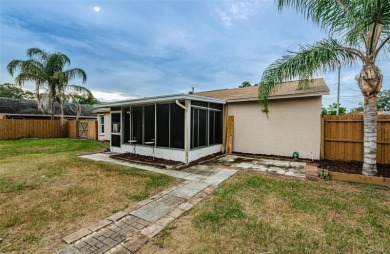 AFFORDABLE HOME IN THE HEART OF SPRING HILL ~ Welcome to this on Oak Hills Country Club in Florida - for sale on GolfHomes.com, golf home, golf lot